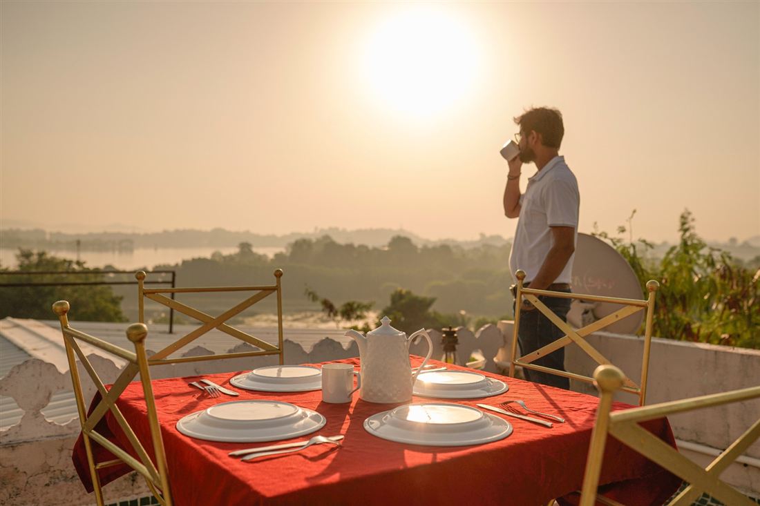Chai and snacks served on the terrace with a lake view