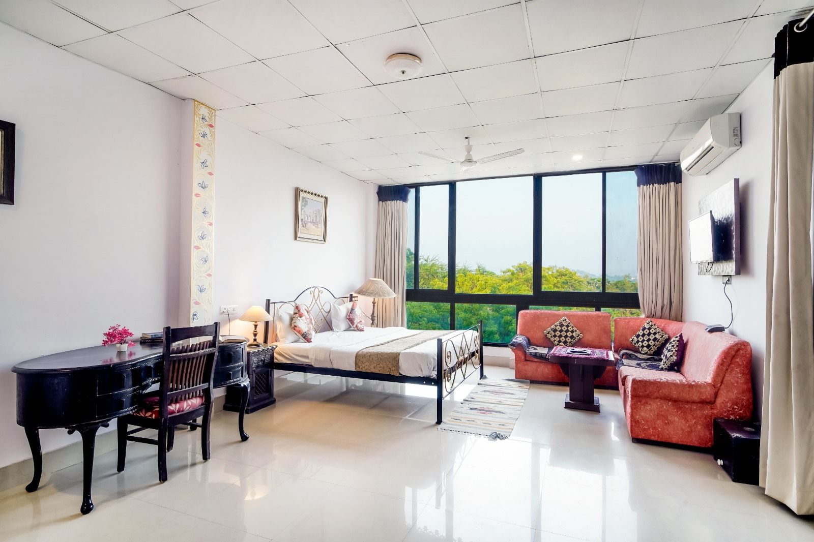 Lake-view room at Vikram Garh Lakeview with a window onto Fateh Sagar